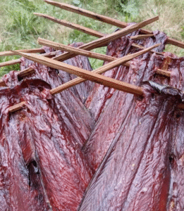 Smoked salmon on wooden spears