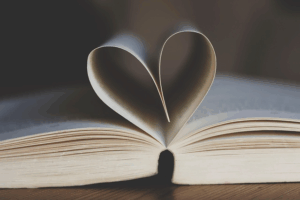 Book pages bend into the shape of a heart