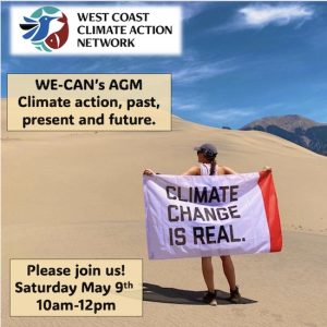 A woman holding a flag that says "Climate change is real"