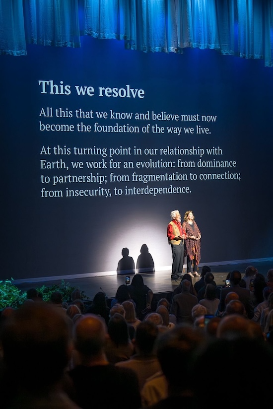 David Suzuki on stage giving a talk