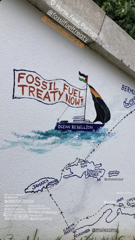 A mural with a ship - says "Fossil Fuel Treaty Now"