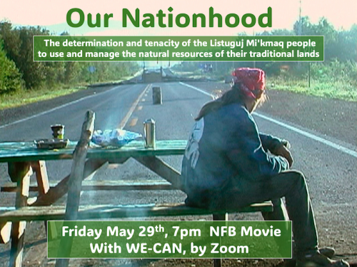 A Indigenous person sitting on a picnic bench in the middle of the road
