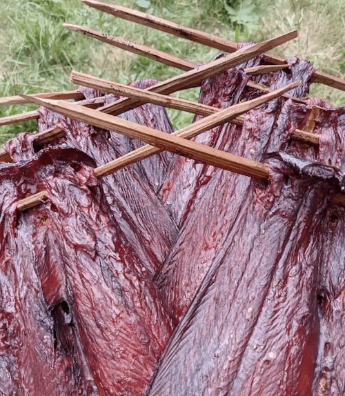 Smoked salmon on wooden spears
